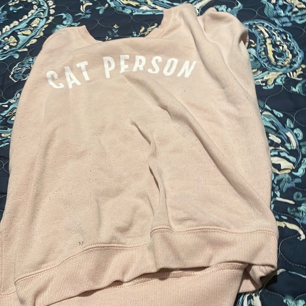 This is a basic label cat person shirt.